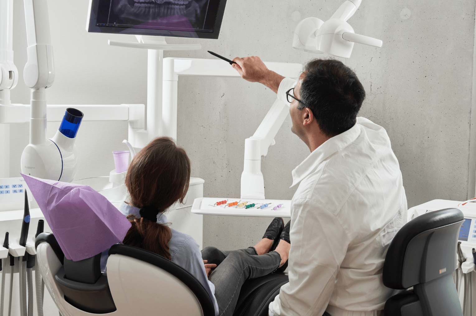 dentist and patient at a dental implant consultation in Marylebone