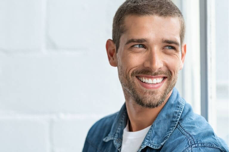 Man smiling after smile makeover at 19 Wimpole Street Dental